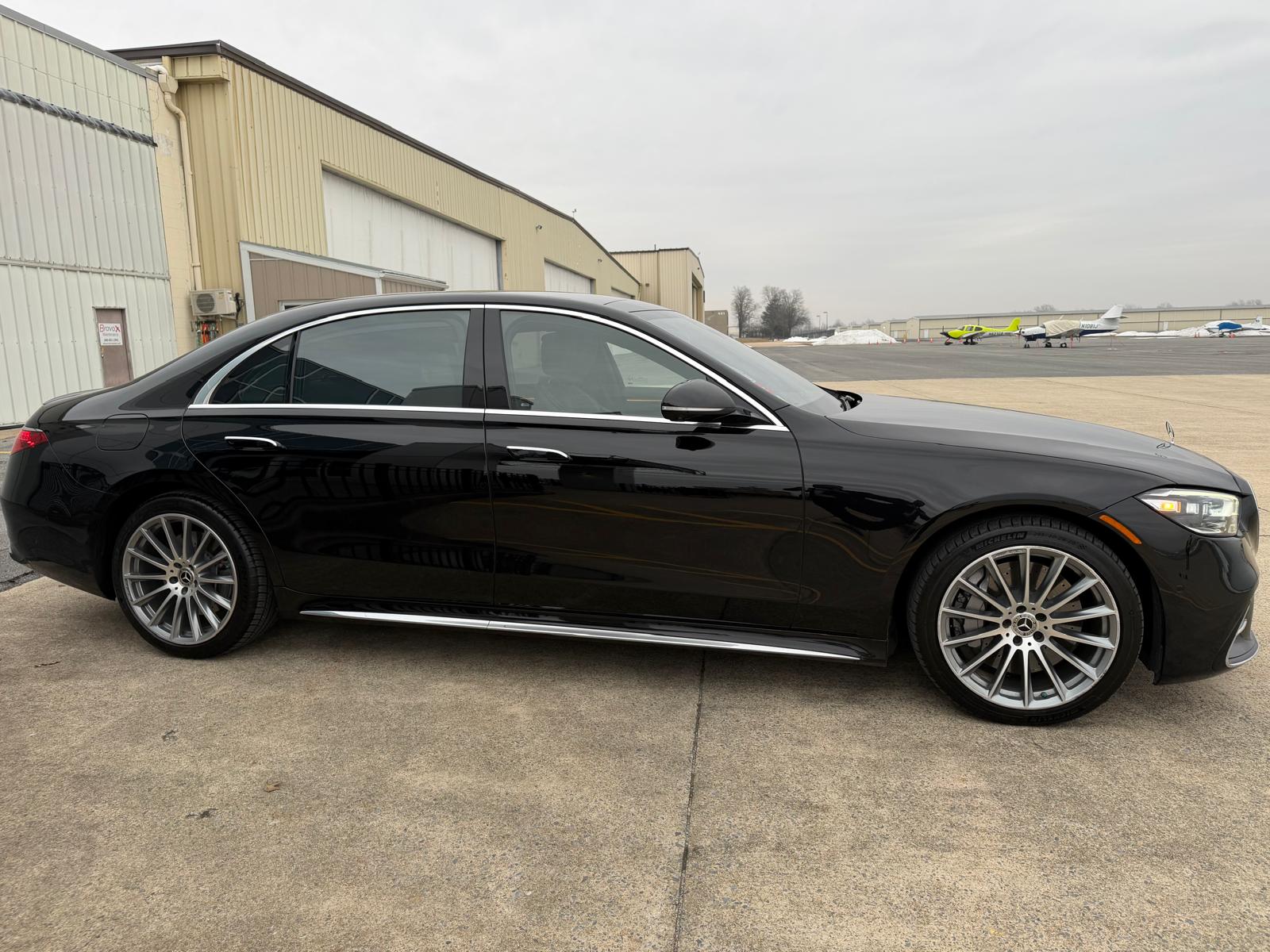 Premium black car road shot — Corporate Class Transport D.C. executive transportation